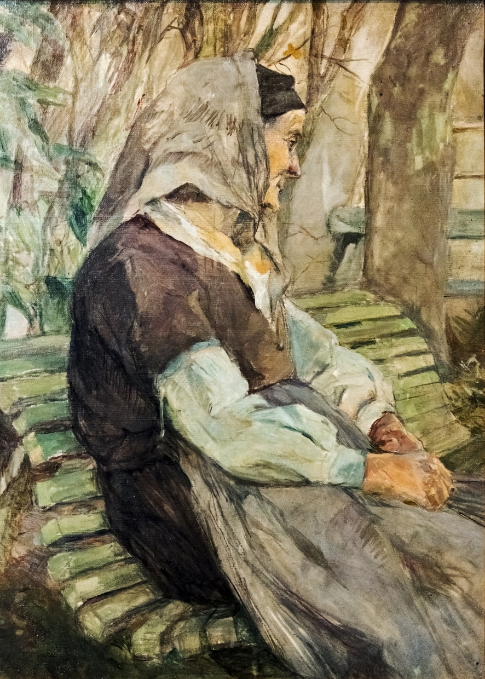 8001 Old woman sitting on a bench in Céleyran